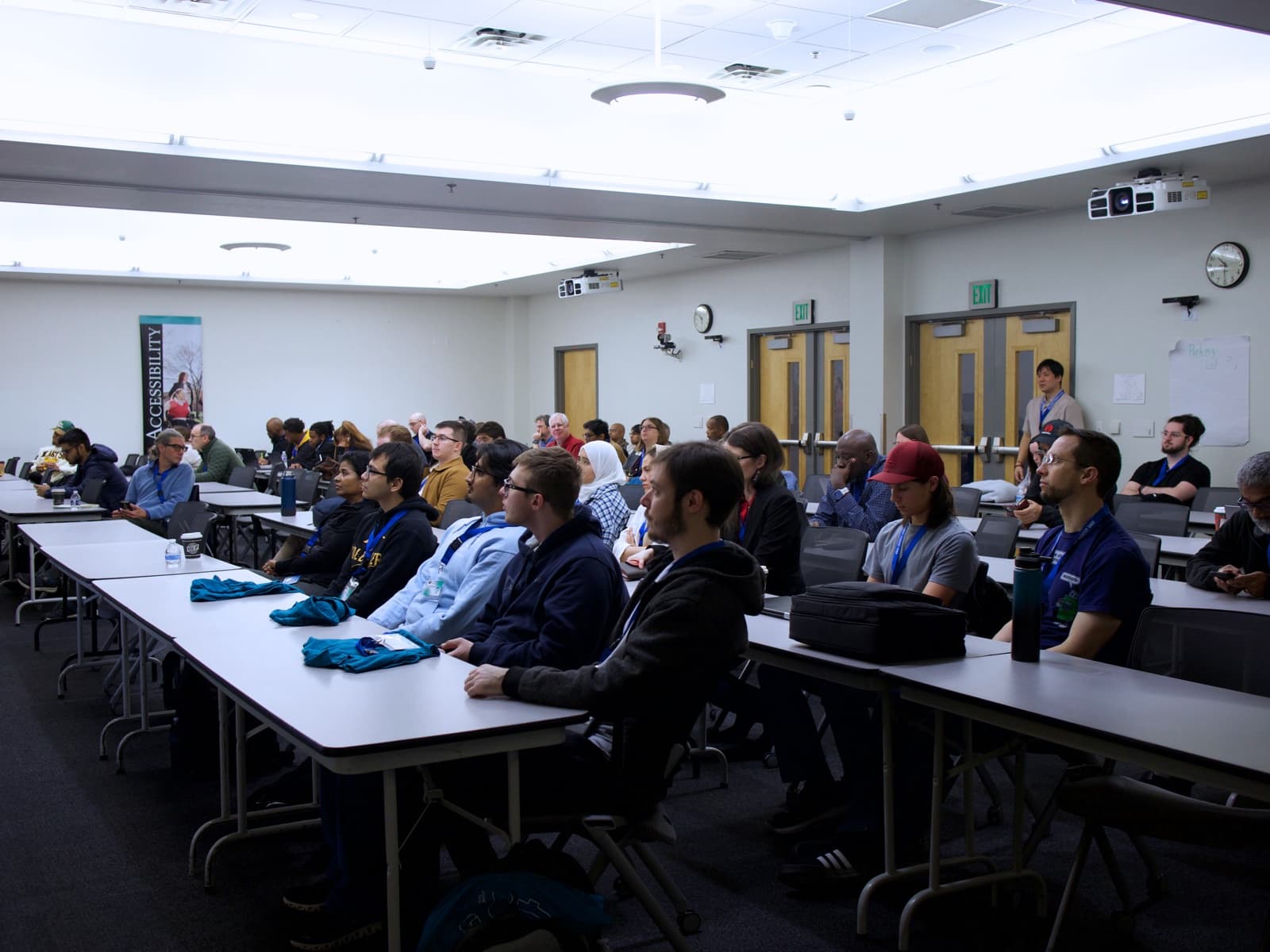 Attendees listen intently to one of the DevFest 2025 presentations